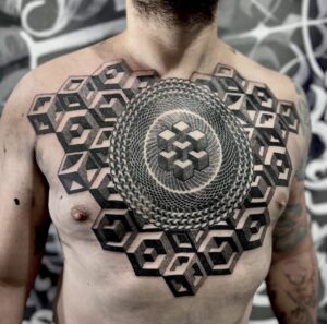 Tatuaje geométrico de mandala realizado en Trip N' Tattoo Barcelona